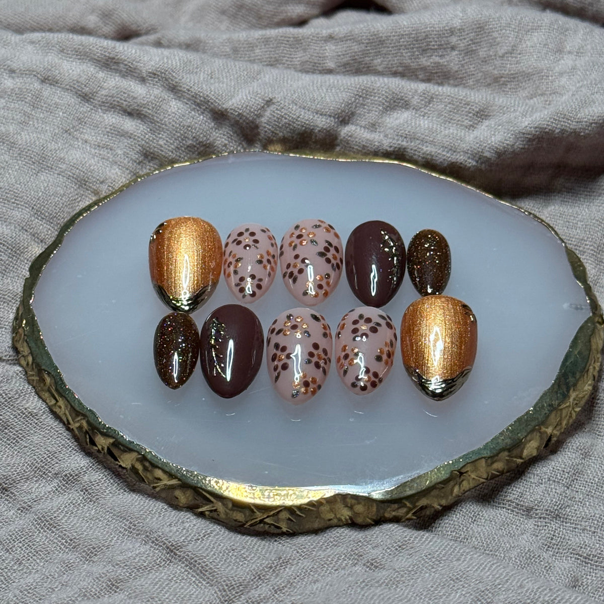 handmade deep maroon and shimmery orange press on nails with floral, chrome and sparkle accents, reusable, custom handmade press on nails, easy at-home manicure