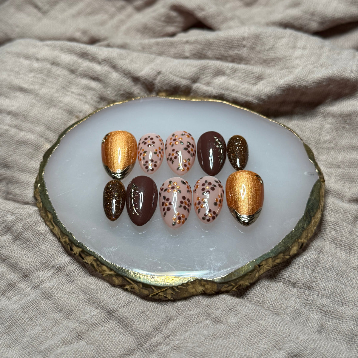 handmade deep maroon and shimmery orange press on nails with floral, chrome and sparkle accents, reusable, custom handmade press on nails, easy at-home manicure