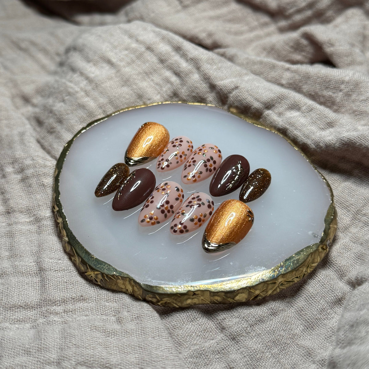 handmade deep maroon and shimmery orange press on nails with floral, chrome and sparkle accents, reusable, custom handmade press on nails, easy at-home manicure