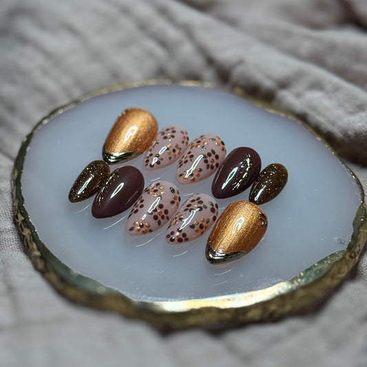 handmade deep maroon and shimmery orange press on nails with floral, chrome and sparkle accents, reusable, custom handmade press on nails, easy at-home manicure