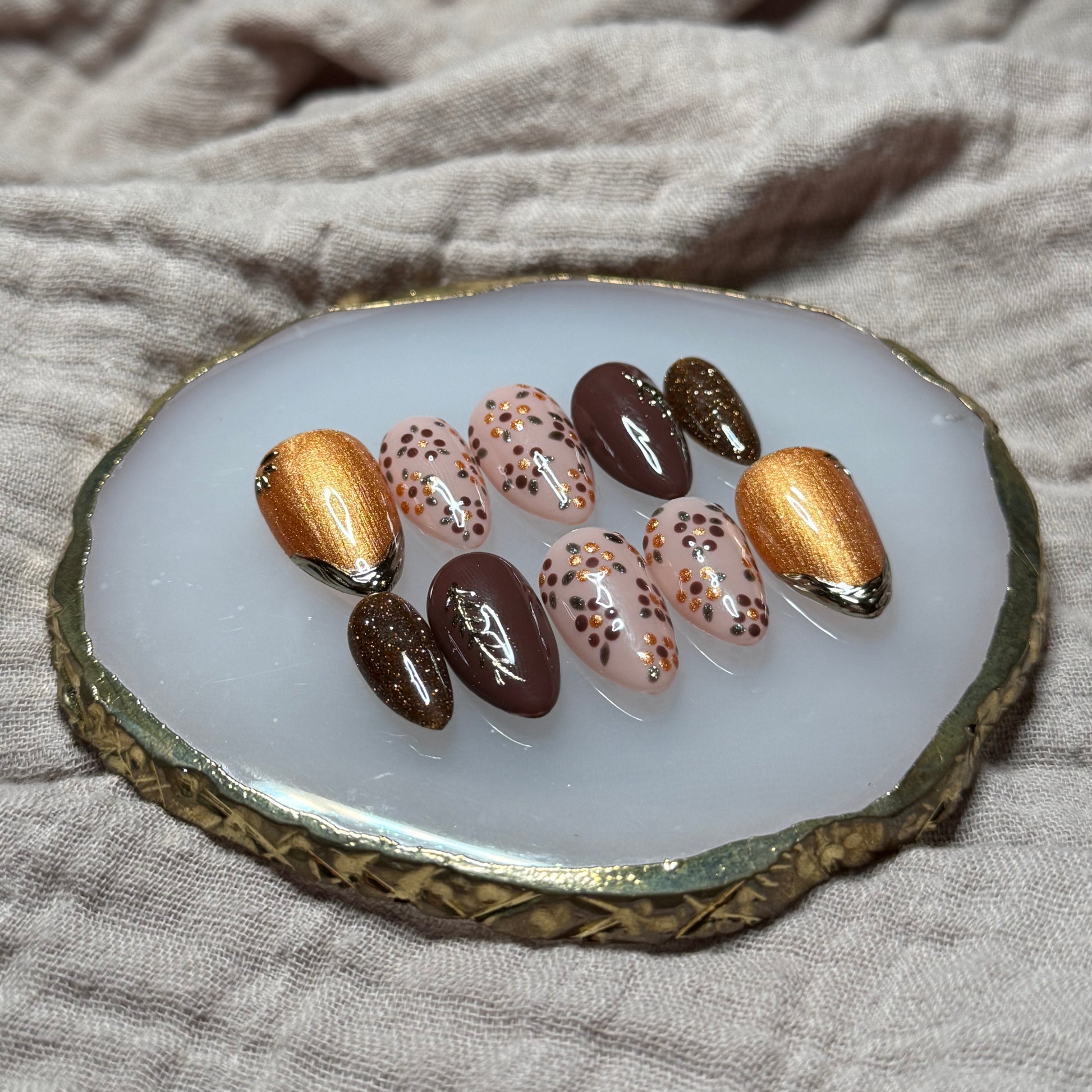 handmade deep maroon and shimmery orange press on nails with floral, chrome and sparkle accents, reusable, custom handmade press on nails, easy at-home manicure