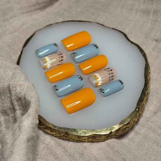 handmade burnt orange and blue-ish grey press on nails with golden chrome accents, reusable, custom handmade press on nails, easy at-home manicure