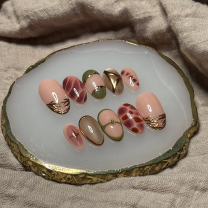 handmade abstract press on nails with deep fall reds, browns and green designs and chrome accents, reusable, custom handmade press on nails, easy at-home manicure