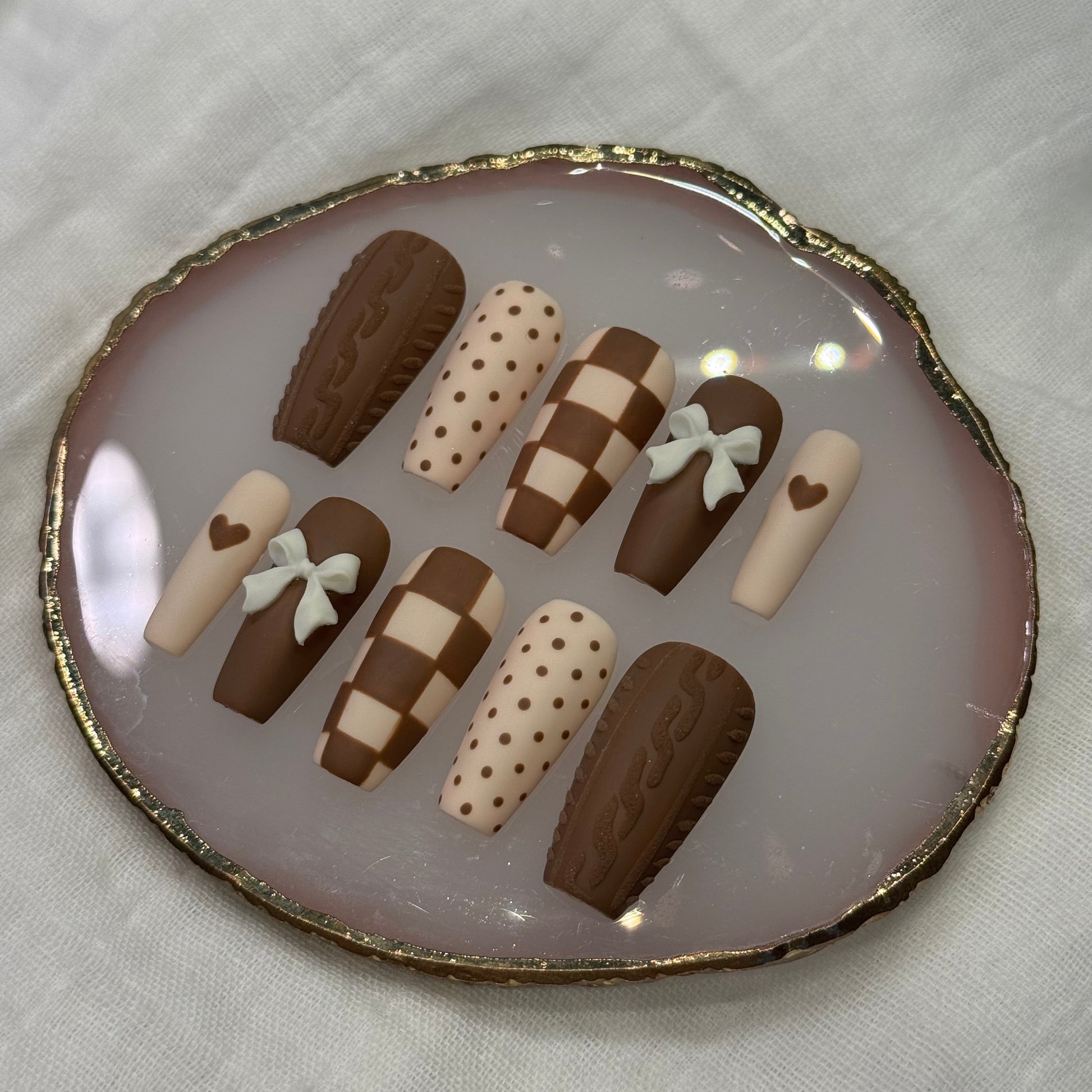 handmade brown & cream press on nails with sweater design & bow charms