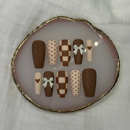 handmade brown & cream press on nails with sweater design & bow charms