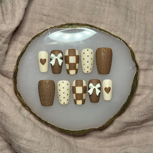handmade brown & cream press on nails with sweater design & bow charms
