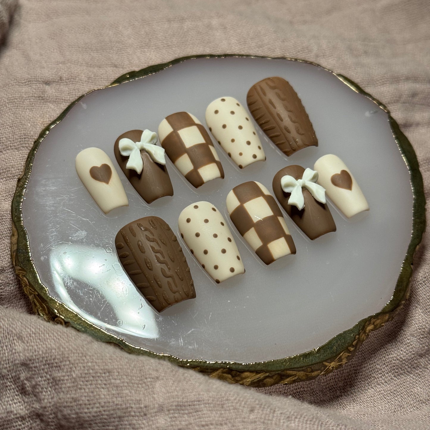 handmade brown & cream press on nails with sweater design & bow charms