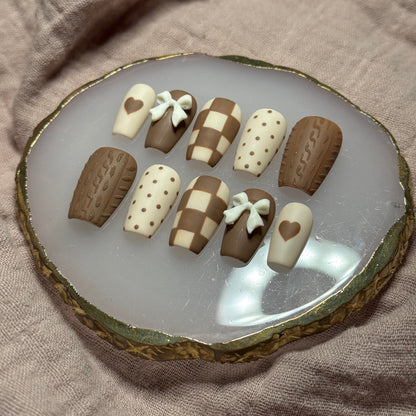 handmade brown & cream press on nails with sweater design & bow charms